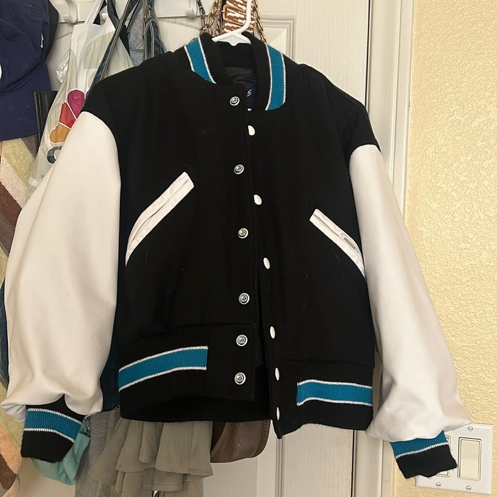 Never worn teal black and white letterman’s jacket.